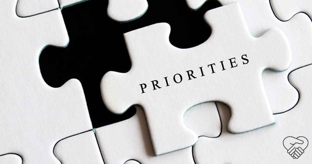 Why Saying "No" is Vital When Caring for a Loved One with Dementia A close-up shot of a nearly completed jigsaw puzzle. One crucial piece is missing from the center, and on that missing piece, the word "PRIORITY" is written in clear, bold letters.